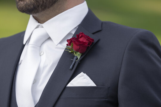 groom with roses
