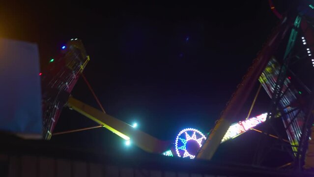 Park amusement in the evening and night illumination. amusement park at night