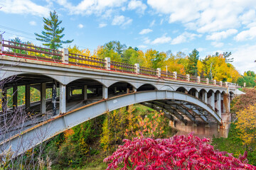 Highway bridge with scenic view of autumn foliage