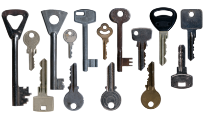 Various old keys for locks in an apartment on an isolated background.