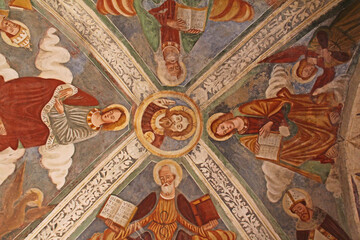 Cristo e i quattro Evangelisti; affresco del soffitto del presbiterio nella chiesa di San Cassiano a Zone (Brescia) - obrazy, fototapety, plakaty