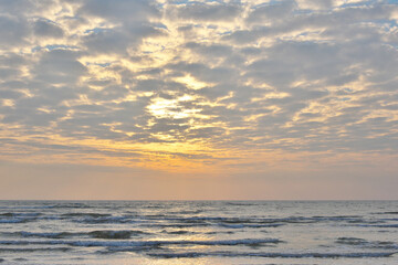 Fototapeta na wymiar Sunset over the sea in pastel colors.