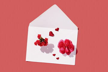 Love letter envelope with red heart on red pastel background