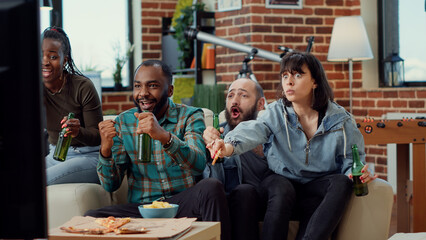 Diverse people cheering to win football match game on tv channel, watching soccer championship...