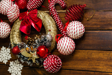 Christmas background wreath with red and white balls decoration, for tree branches, candy canes, and snowflakes