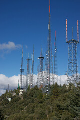 hilltop with communication towers, satellite dishes and weather instruments