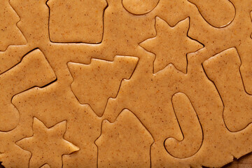 Cutting out Christmas gingerbread dough