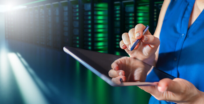 Tablet in woman hands. Hosting provider manager. Girl oversees work of server equipment. Woman with electronic tablet in it company. Server rental concept. Servers for hosting company