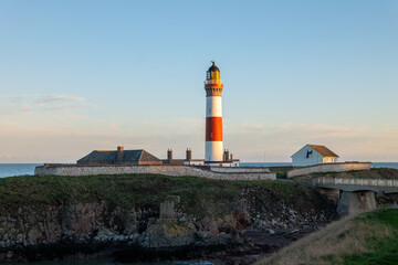 Fototapeta na wymiar 3 November 2022. Boddam, Aberdeenshire, Scotland. This is the Buchan Ness Lighhouse in Boddam as the sun was setting for the day.