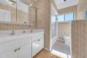 Bathroom with carpet and wallpaper