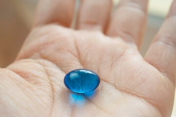 Fototapeta premium medicine capsule in hand