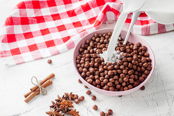 sweet crunchy chocolate children's breakfast chocolate balls on a white background