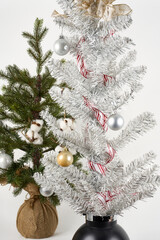 Christmas trees with ornaments isolated on white 