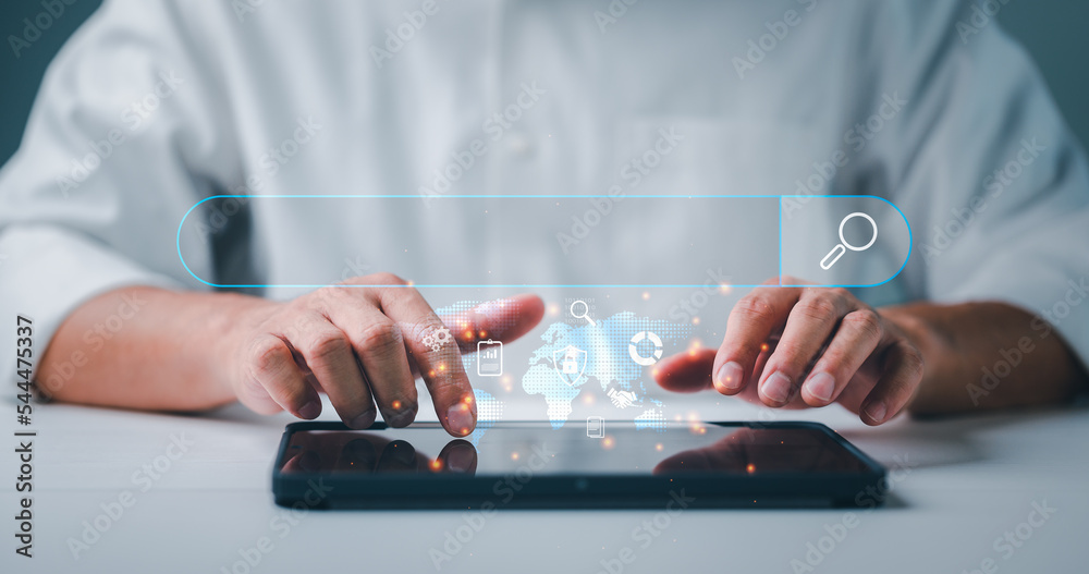 Fototapete Data Search Technology Search Engine Optimization. man's hands are using computer tablet to Searching for information. Using Search Console with your website, job search, finding data, information.