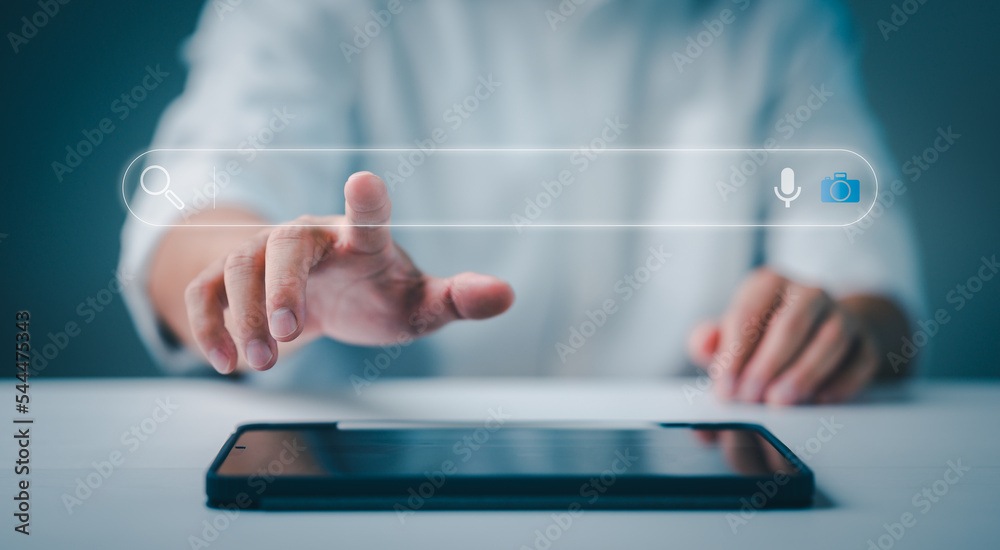 Fototapete Data Search Technology Search Engine Optimization. man's hands are using computer tablet to Searching for information. Using Search Console with your website, job search, finding data, information.