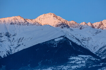 Caucasian Peak covered with snow in the light of the rising sun, Mestia, Svaneti, Georgia