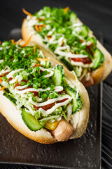 vegetarian sausage hot dog on a black rustic wooden background