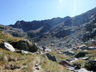 Fototapeta premium Pyrenees, Carros de Foc hiking tour. A week long hike from hut to hut on a natural scenery with lakes, mountains and amazing flora and fauna. 