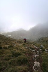 Obraz premium Pyrenees, Carros de Foc hiking tour. A week long hike from hut to hut on a natural scenery with lakes, mountains and amazing flora and fauna. 