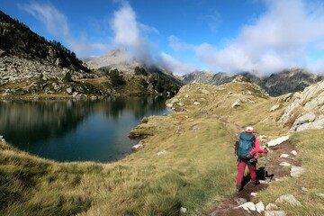 Fototapeta na wymiar Pyrenees, Carros de Foc hiking tour. A week long hike from hut to hut on a natural scenery with lakes, mountains and amazing flora and fauna. 