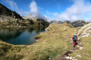 Fototapeta premium Pyrenees, Carros de Foc hiking tour. A week long hike from hut to hut on a natural scenery with lakes, mountains and amazing flora and fauna. 