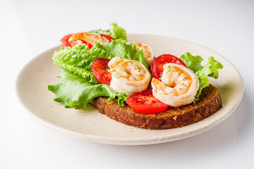 delicious Italian bruschetta with shrimps on a white background