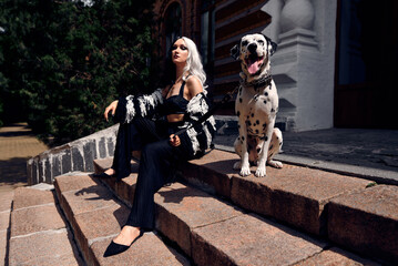 Cosplay on Cruella de Vil with a Dalmatian