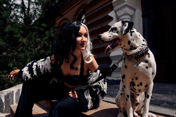 Cosplay on Cruella de Vil with a Dalmatian