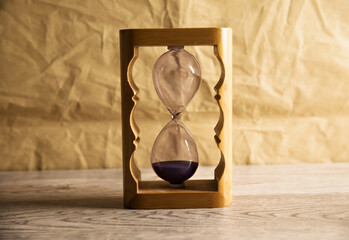 Hourglass on a wooden table