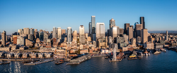 Seattle Downtown, Washington, USA, aerial view of Seattle Downtown and the Waterfront pier area with The Seattle Great Wheel during sunset - aerial panoramic view 