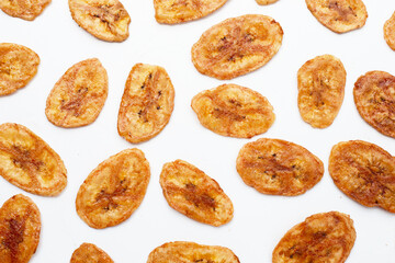 Banana chips on white background
