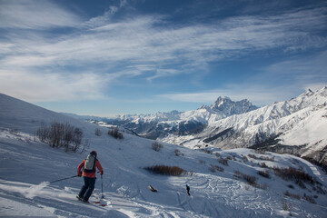 Fototapeta na wymiar freeride at the ski resort on the background Mount Ushba covered with snow and glaciers, Caucasus Mountains, Georgia