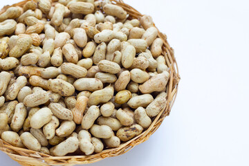 Raw peanuts on white background.