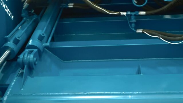 Power hydraulic cylinders provide great force for compacting garbage in a garbage truck. Shot in motion