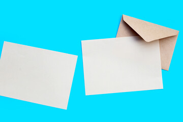 Brown paper and envelopes on blue background.