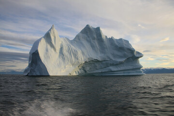 Fototapeta na wymiar Stranded iceberg and ice near evening in arctic