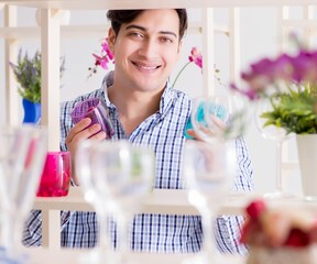 Young handsome man shopping in shop