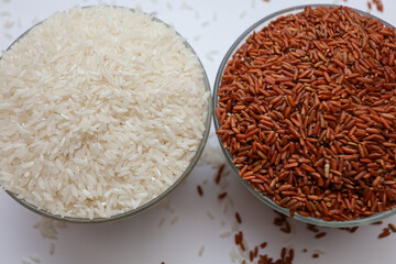 brown rice and white rice.  asian staple food.  the concept of comparing the benefits of brown and white rice