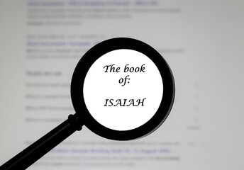 The Book of Isaiah from the Holy Bible, illustrated inside a magnifying class, zoomed in.	