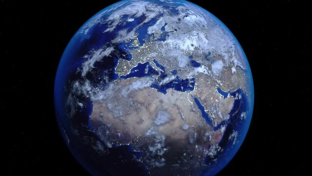 Zoom out of Switzerland through clouds to see the Earth from space.