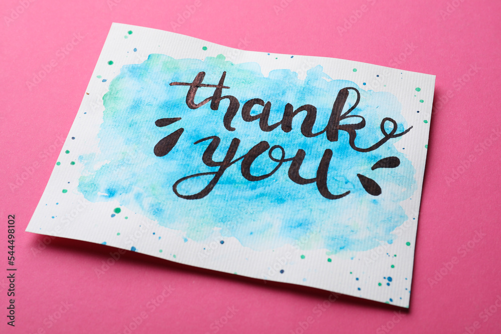 Wall mural card with phrase thank you on pink background