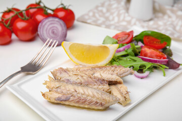 Delicious canned mackerel fillets served on white table - obrazy, fototapety, plakaty