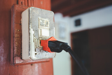 Close up old plug and power switch broken dirty with dangerous