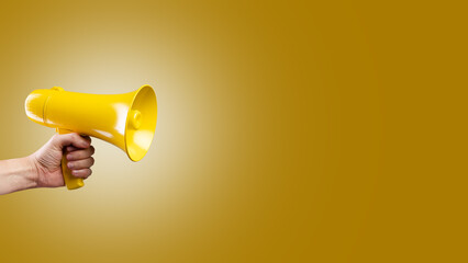 On a yellow background, a yellow megaphone in a person's hand. Minimalism. There is free space to insert. Symbol of false information, rumors, fakes. Elections, media, rallies, protests.
