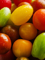 Lots of bright colorful tomatoes. Close-up. Vitamins, antioxidants, healthy food, healthy lifestyle. Ingredient for many dishes. Cooking, recipes, menu design. Advertising, banner.