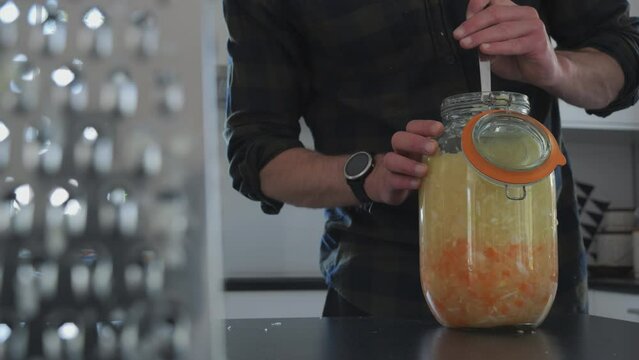Person prepares Sauerkraut at home, fementation process series part 4