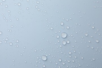 Many water drops on white background, top view