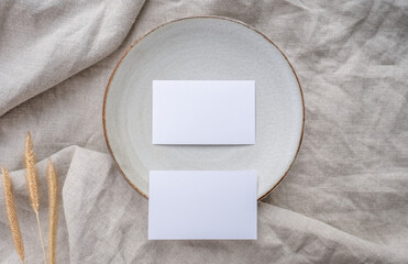 Business card mockup on table setting, minimal scandinavian theme