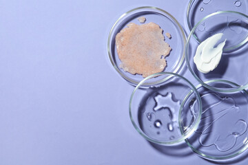 Obraz na płótnie Canvas Flat lay composition with Petri dishes on lilac background. Space for text