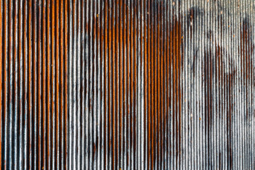 Artistic of old and rusty zinc sheet wall. Vintage style metal sheet roof texture. Pattern of old metal sheet. Rusting metal or siding. Corrosion of galvanized. Background and texture in retro concept